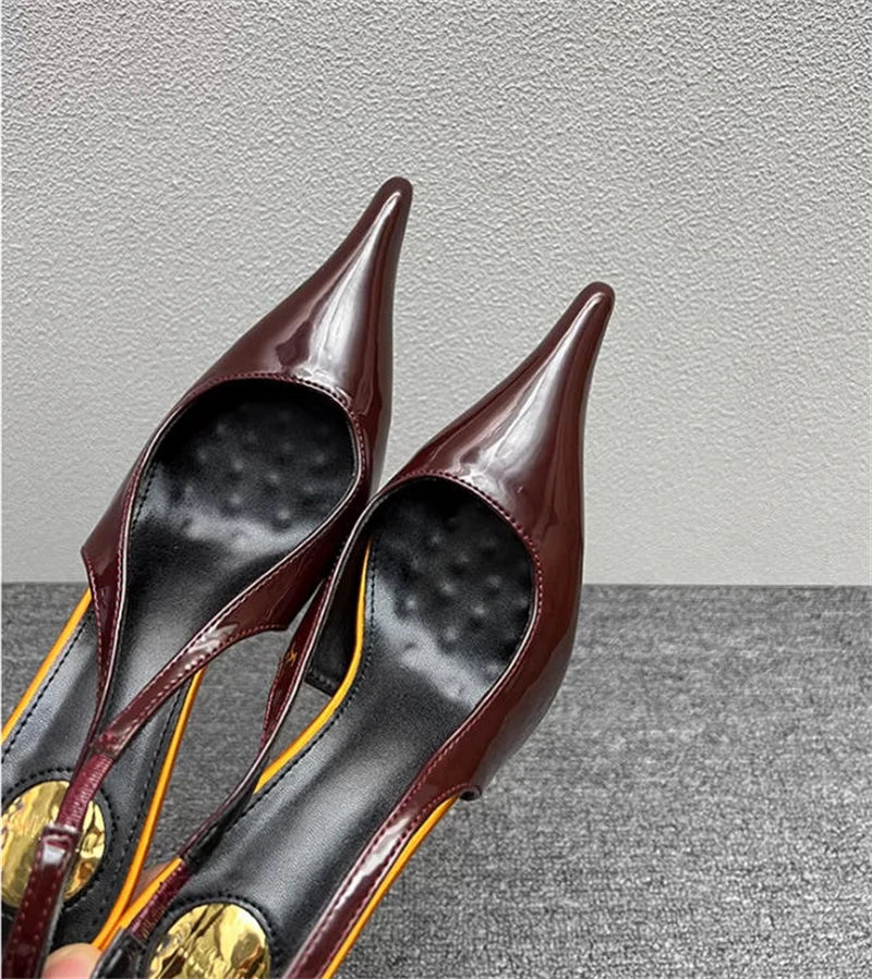 Sculptural Patent Pumps
