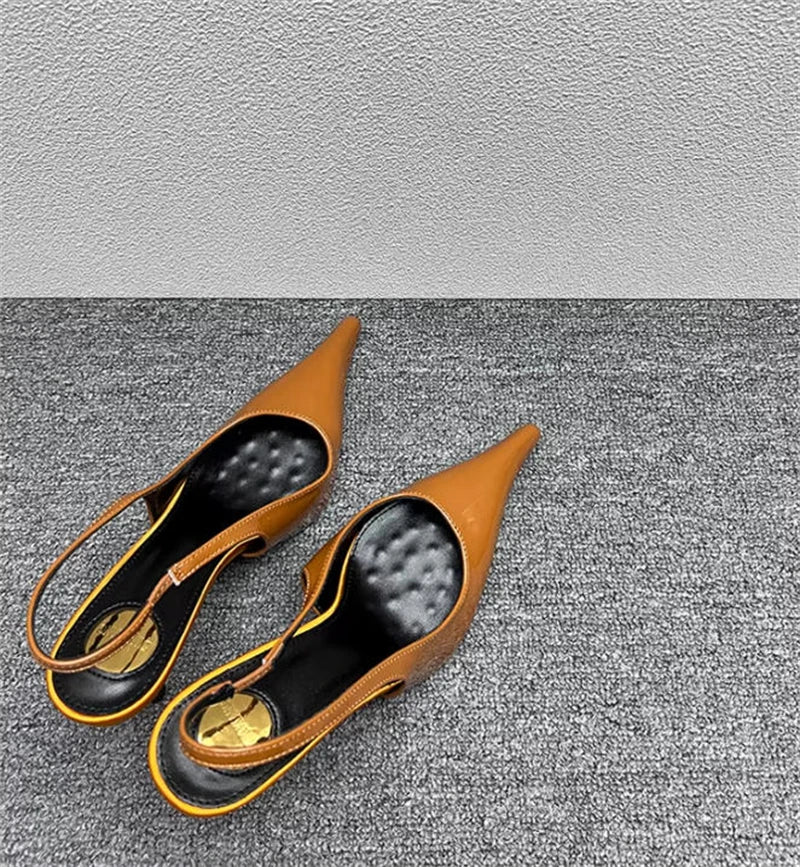 Sculptural Patent Pumps